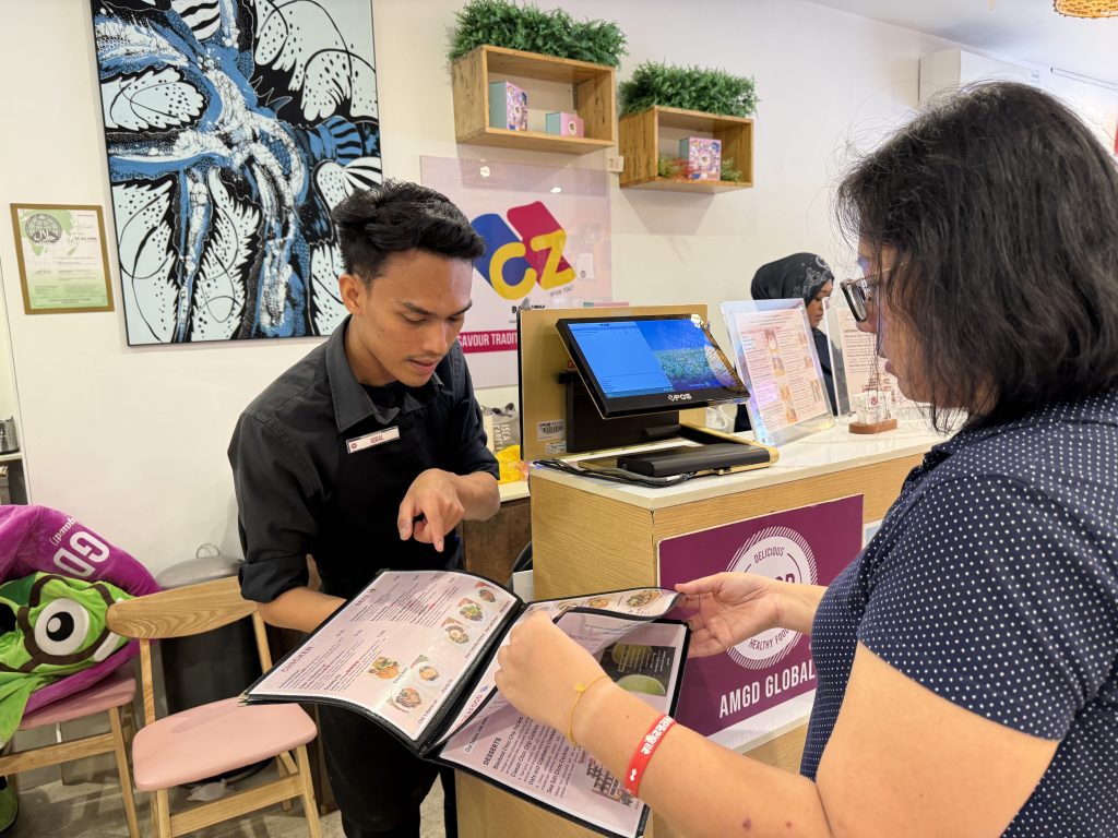a worker at AMGD utilising EPOS System