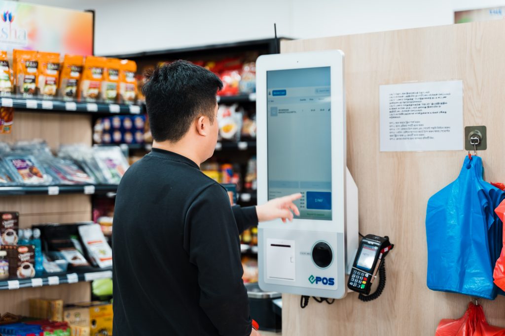 self-checkout kiosk in use